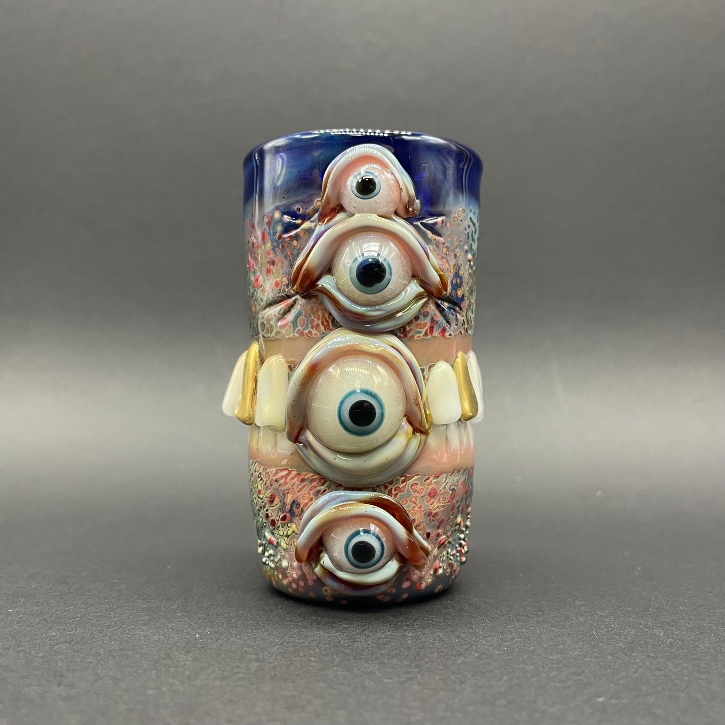 Hand-blown glass Too many teeth shot glass by Leviathan Glass