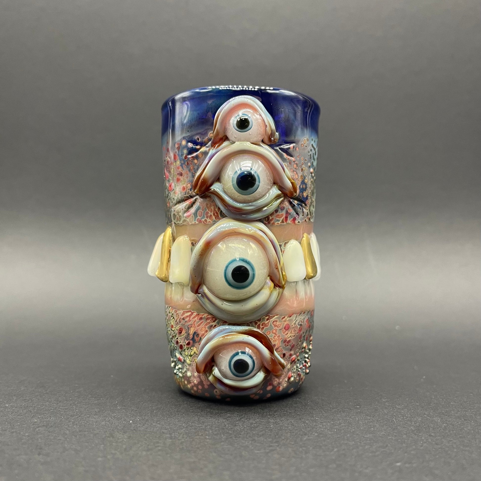 Hand-blown glass Too many teeth shot glass by Leviathan Glass