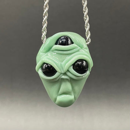Time manipulating three eye glass alien pendant