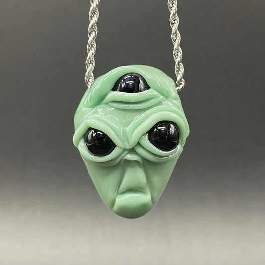 Time manipulating three eye glass alien pendant