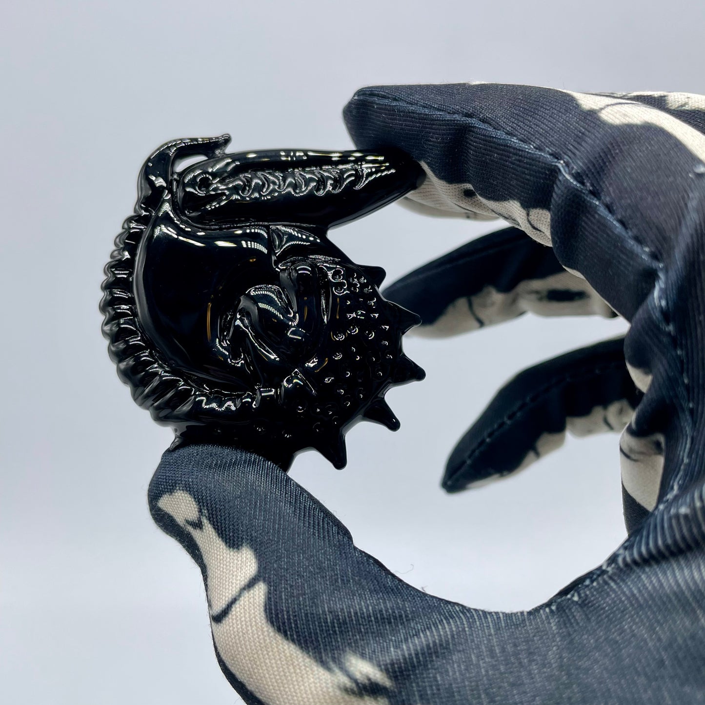 Close-up of Xenomorph pendant - handcrafted glass