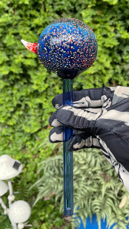 Hand blown glass monster watering globe