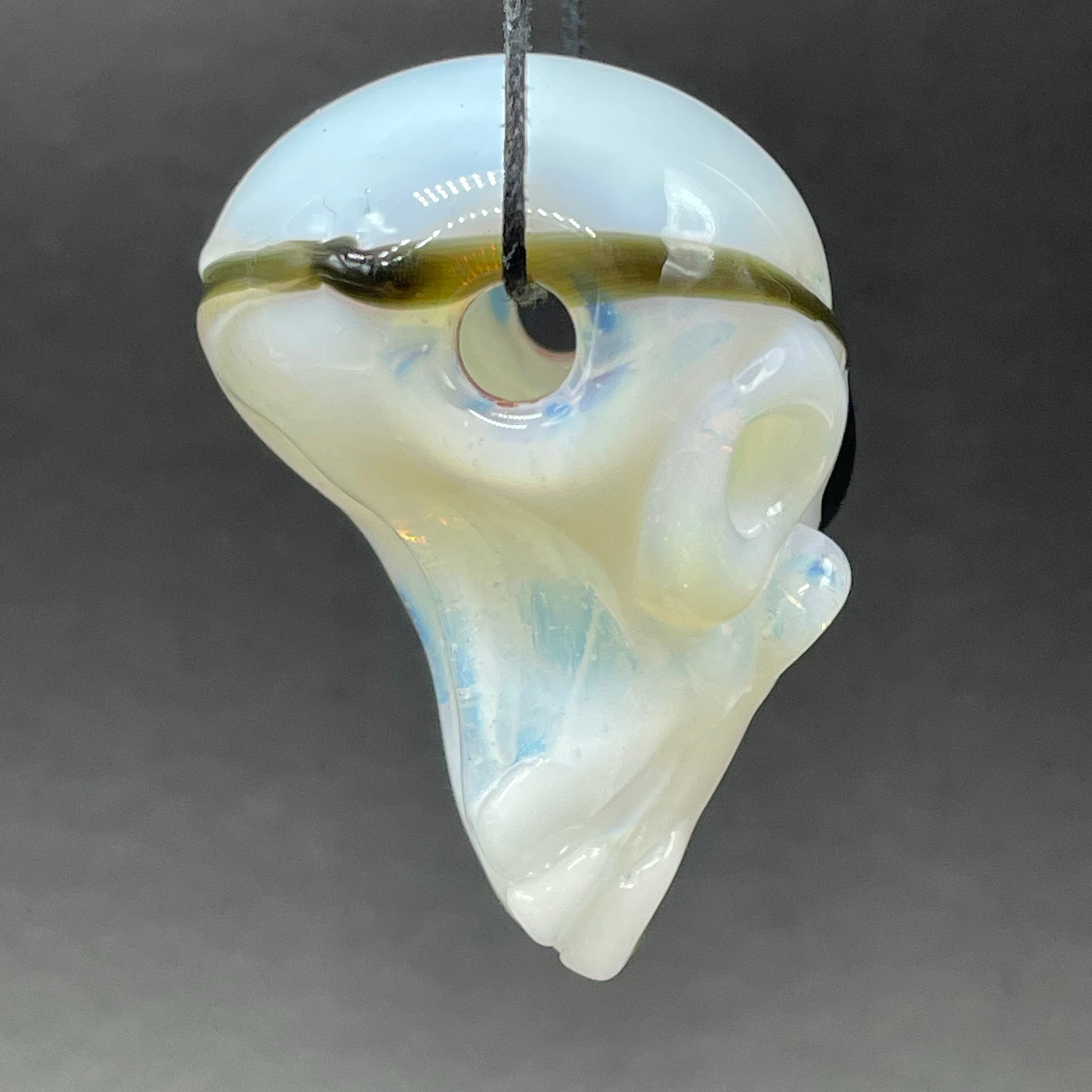 Close-up of one eyed Willie skull pendant - handcrafted glass