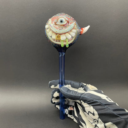 Hand Blown Glass Monster Watering Globe - round cyclops head, blue iris eye, white teeth, gold tooth, teal tongue drips, teal glass stake - Leviathan Glass