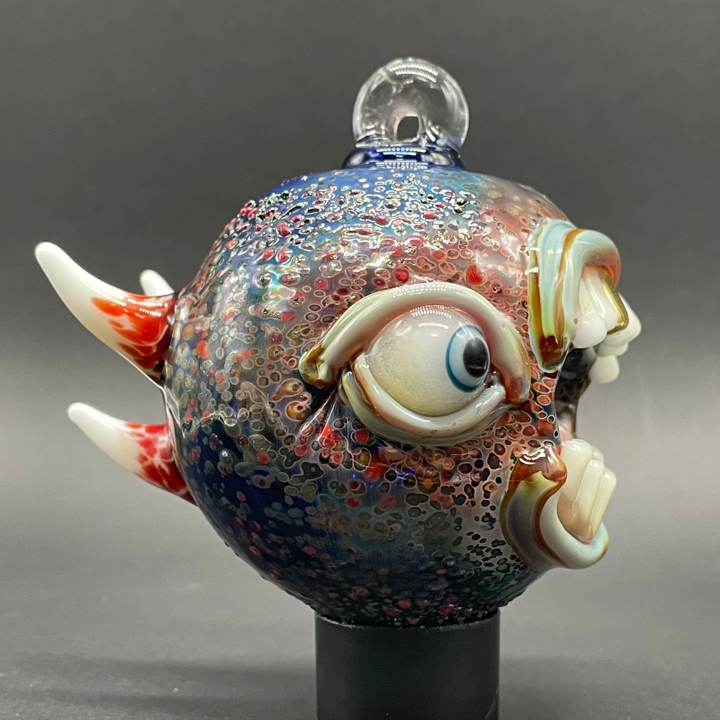 Close-up of Screaming cyclops ornament - handcrafted glass