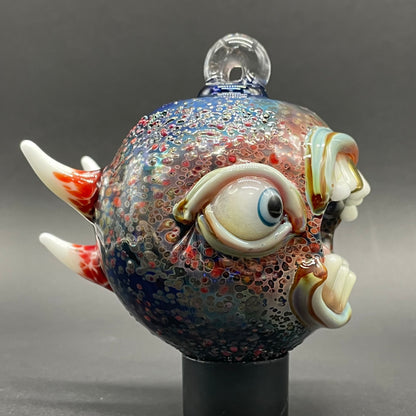 Close-up of Screaming cyclops ornament - handcrafted glass