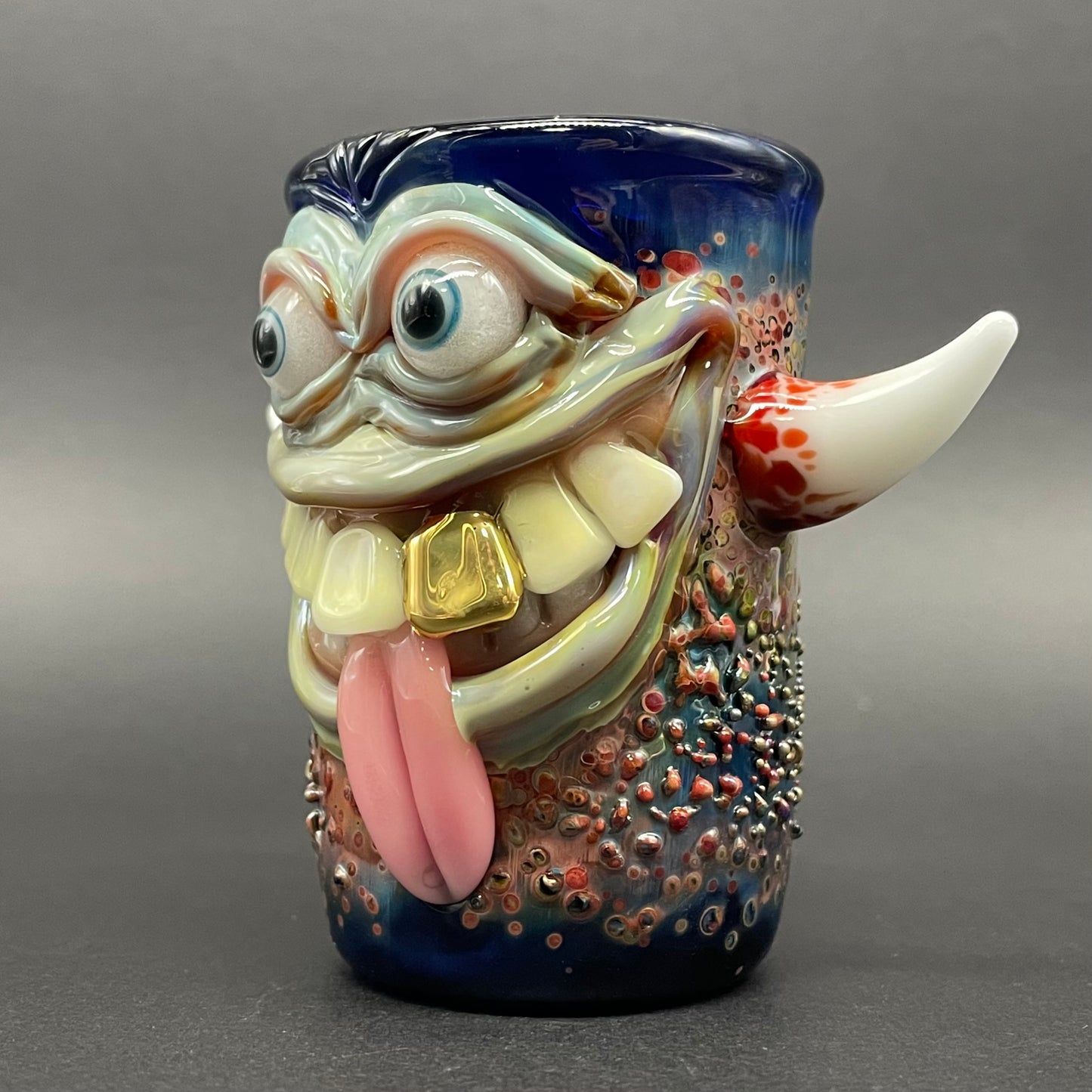 Close-up of Irate pirate shot glass - handcrafted glass
