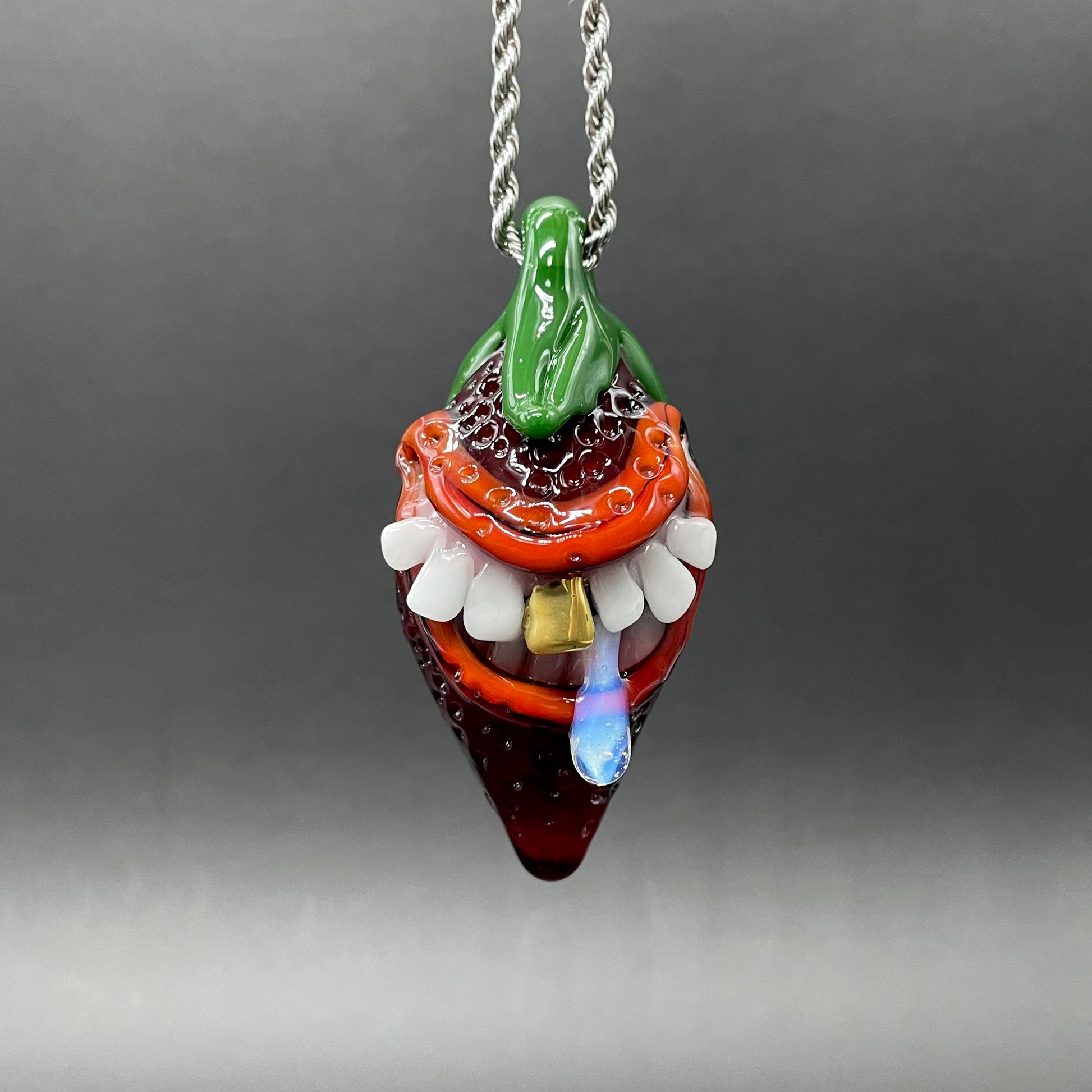 Hand-blown glass Toothy strawberry pendant by Leviathan Glass