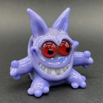 Gengar Pokémon handblown glass pendant - periwinkle purple Gengar sculpture, large red glass eyes, white teeth, clawed hands and feet, silver rope chain - Leviathan Glass
