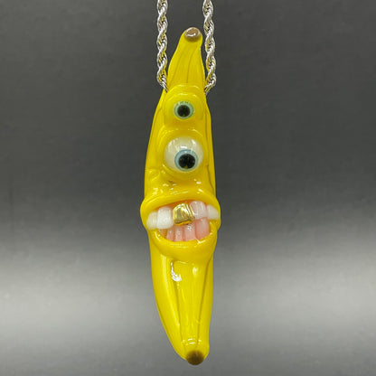 Grinning glass banana pendant