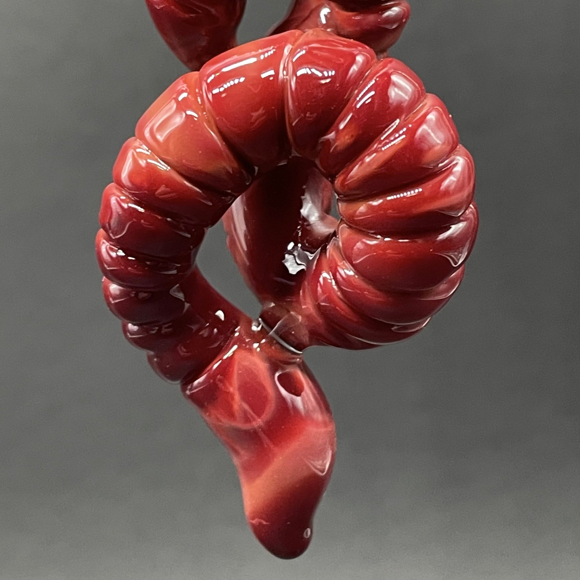 glass earthworm pendant by Leviathan Glass - artisan detail