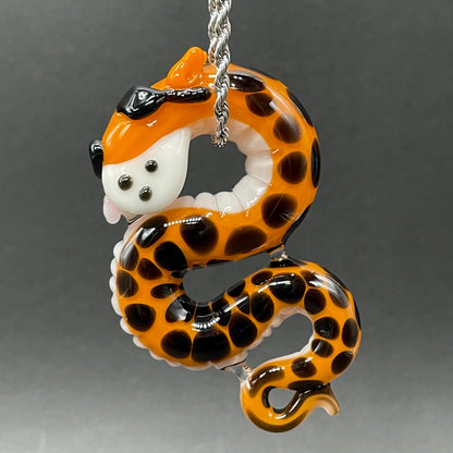 Close-up of Slithering Chester Cheetah glass pendant - handcrafted glass