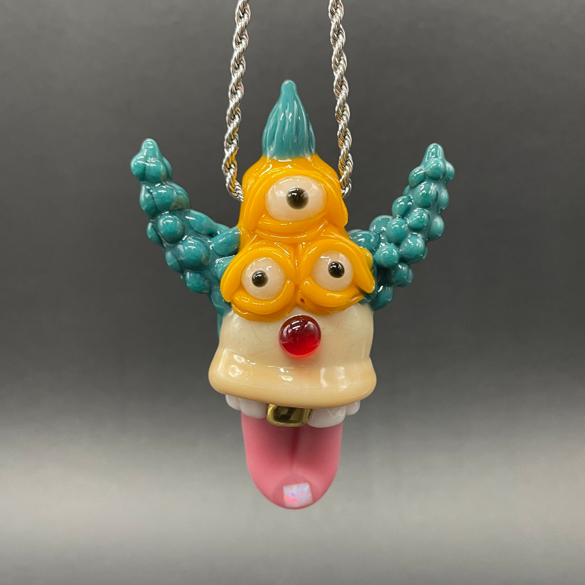 Krusty the Clown handblown glass pendant - Simpsons Krusty clown face with third eye, opal tab accent, white teeth, silver rope chain - Leviathan Glass