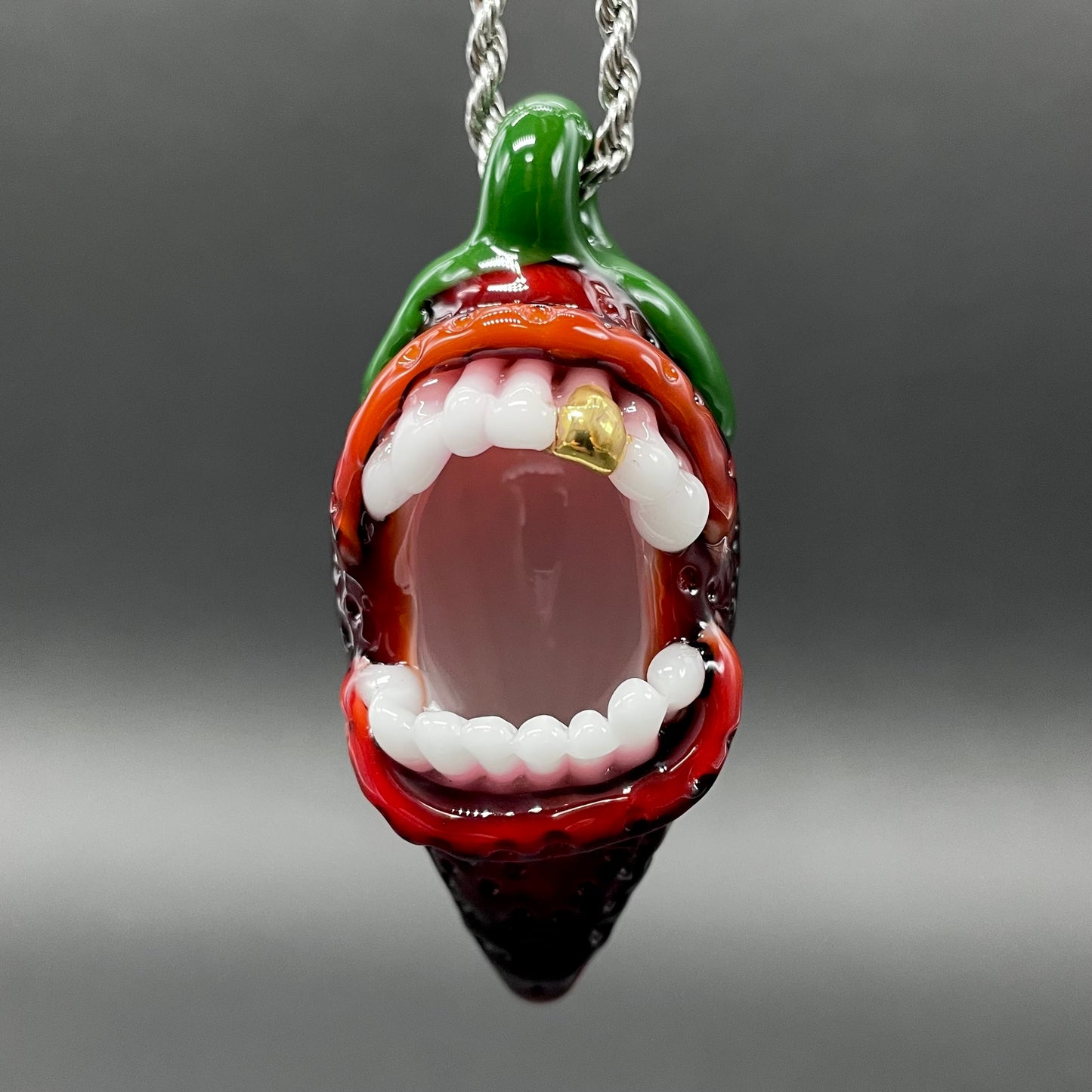 Screaming strawberry glass pendant