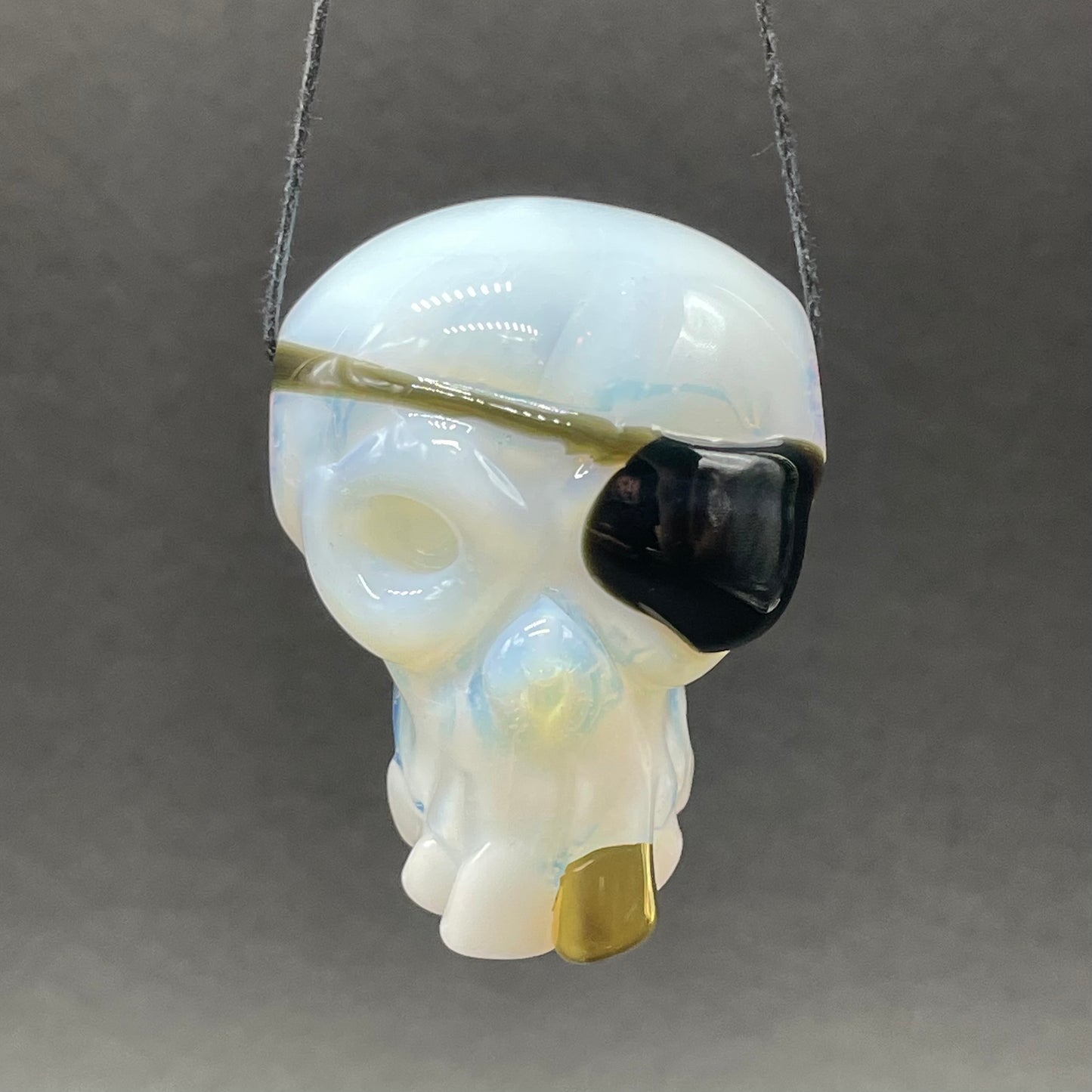 one eyed Willie skull pendant detail view - premium glass art
