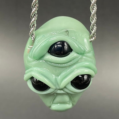 Time manipulating three eye glass alien pendant