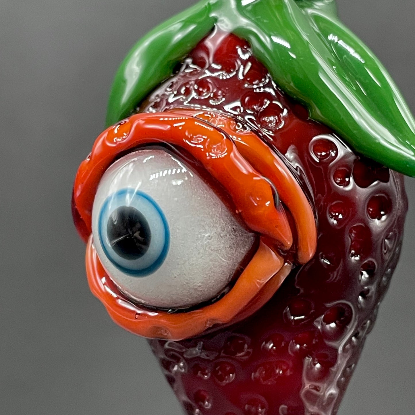 Cyclops strawberry pendant by Leviathan Glass - artisan detail