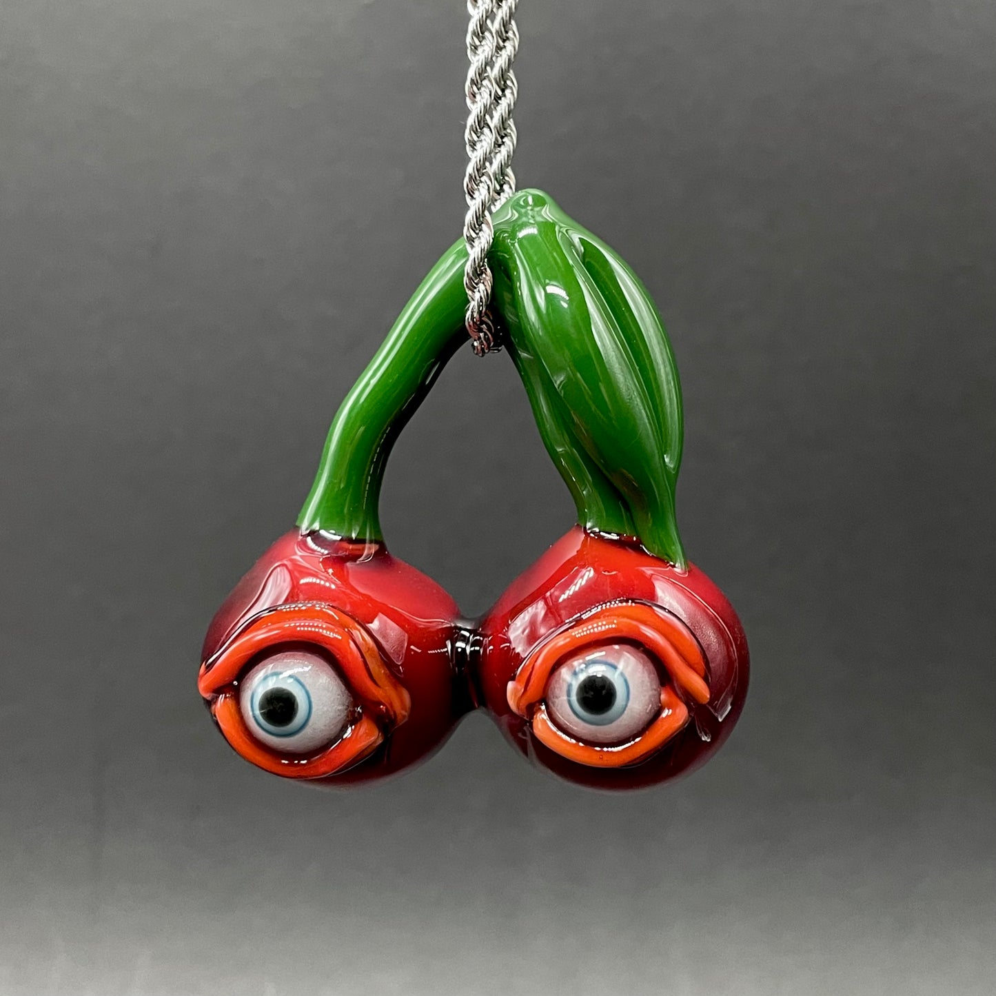 Hand-blown glass Cherry flavored glass eye pendant by Leviathan Glass