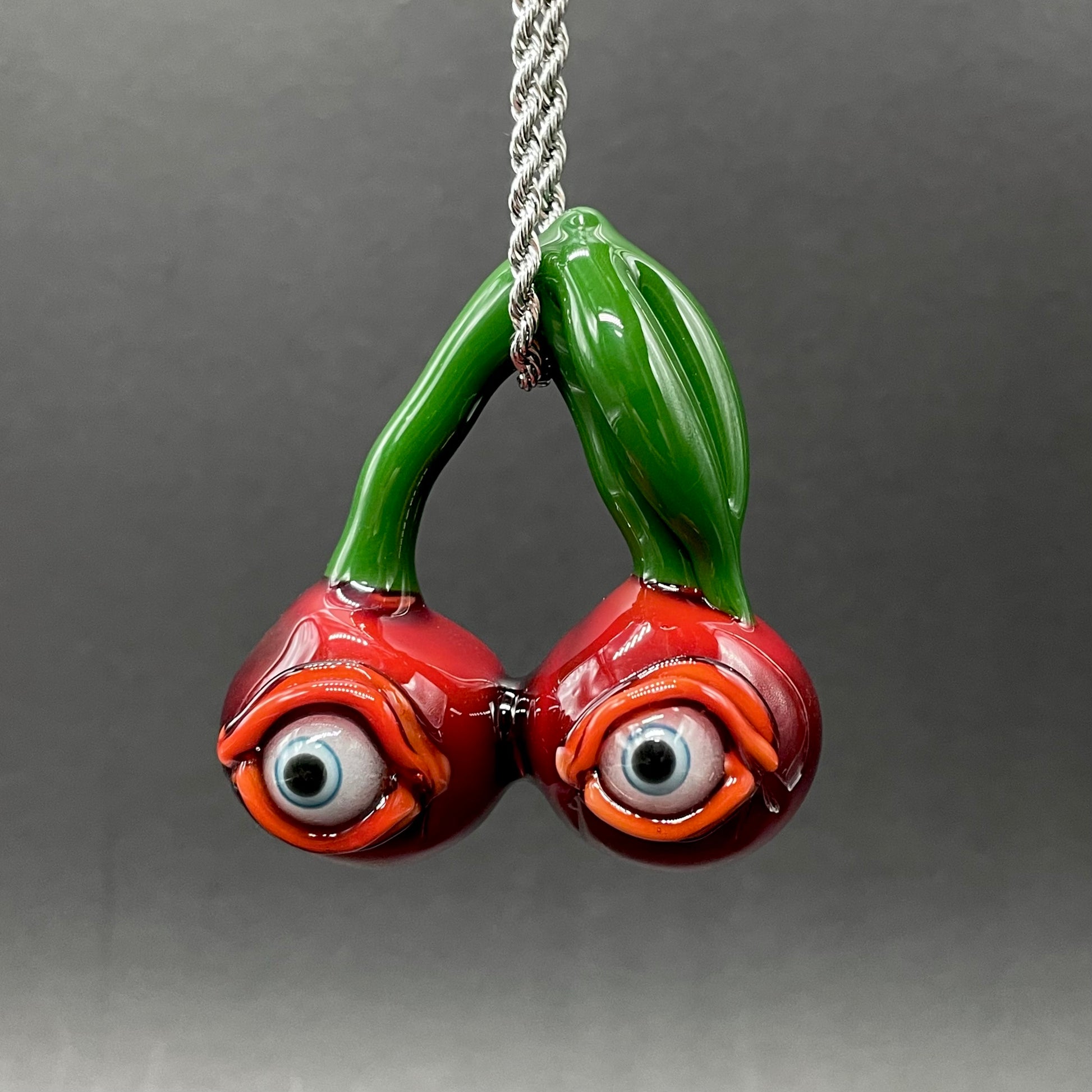 Hand-blown glass Cherry flavored glass eye pendant by Leviathan Glass