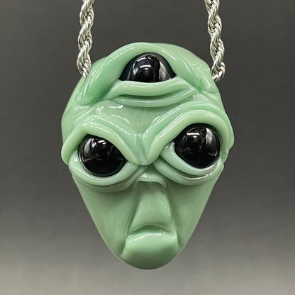 Time manipulating three eye glass alien pendant