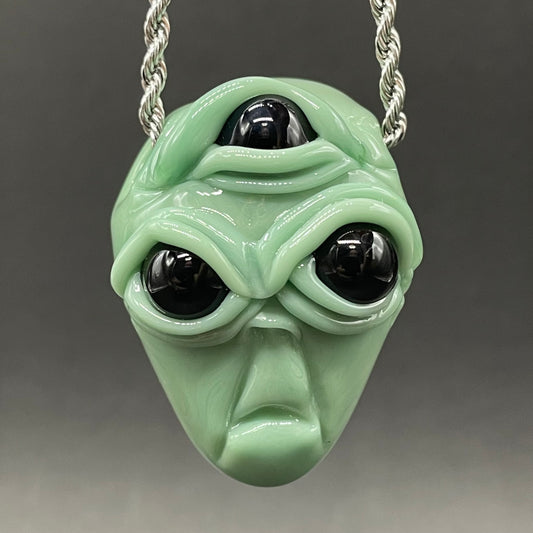 Time manipulating three eye glass alien pendant