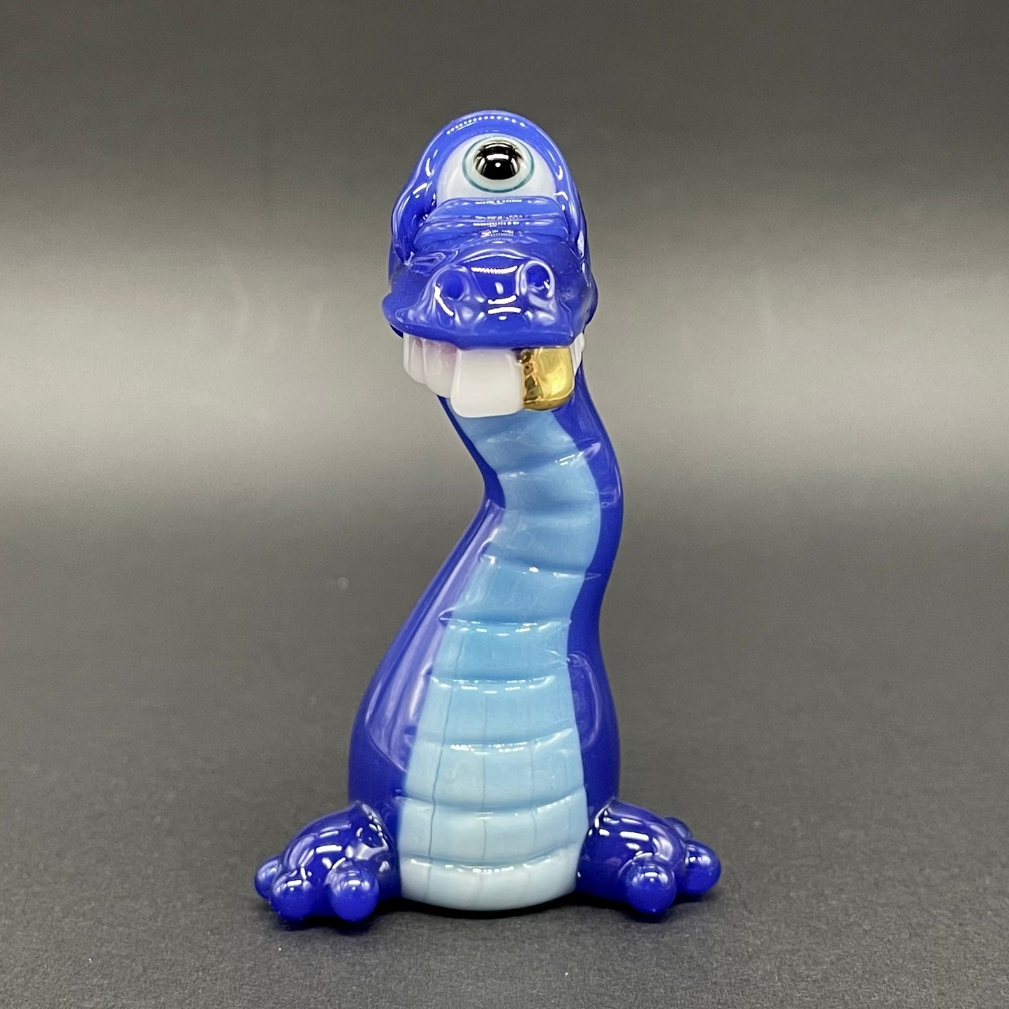 Close-up of Cyclopsasarus glass pendant - handcrafted glass