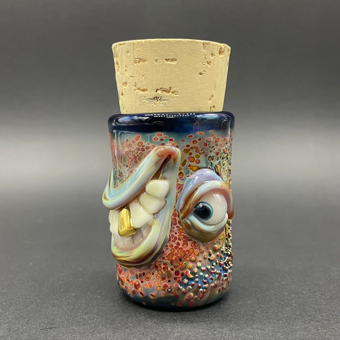 Close-up of Side eye Cyclops Cork Jar - handcrafted glass