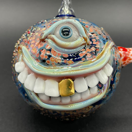 Smiling cyclops ornament detail view - premium glass art