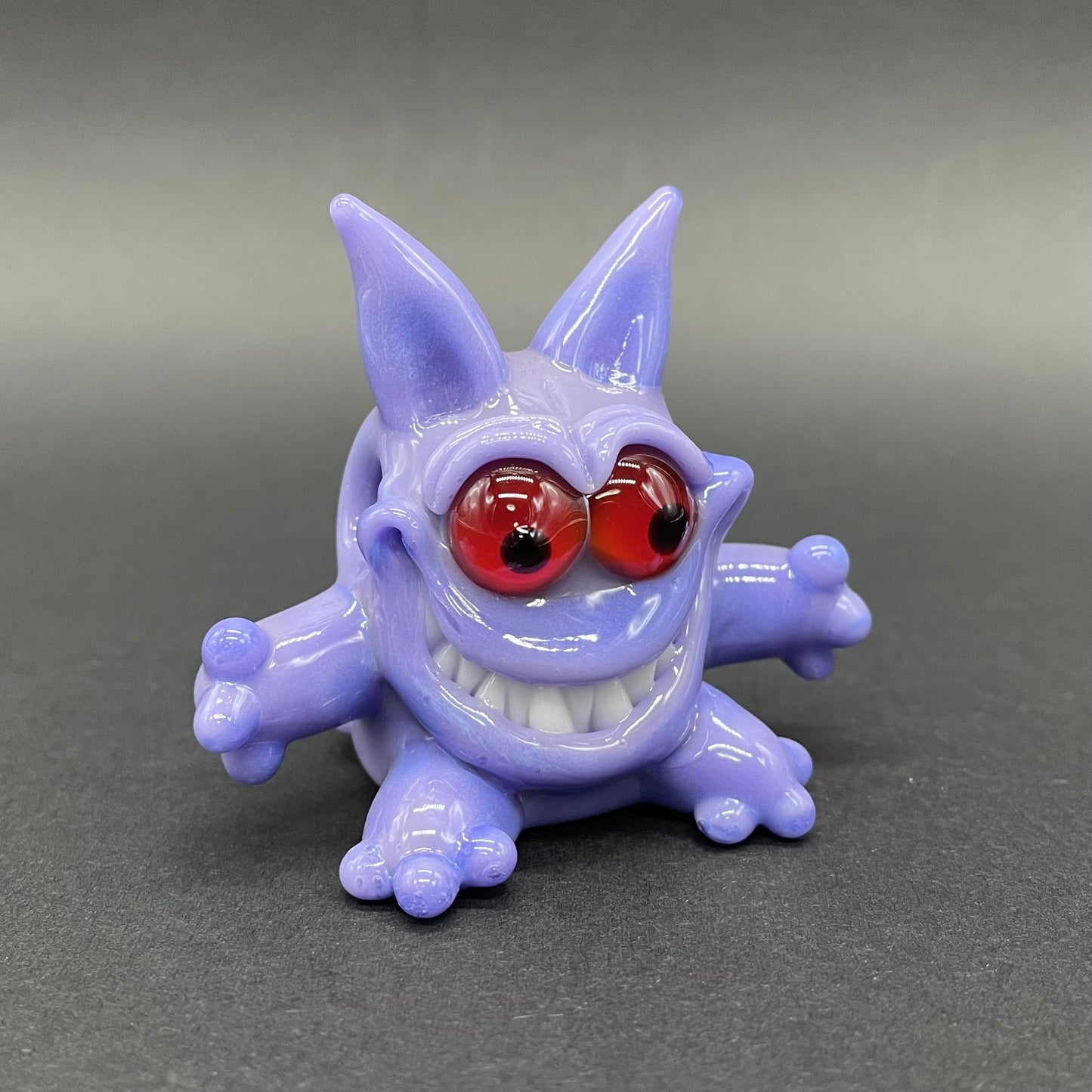 Gengar Pokémon handblown glass pendant - periwinkle purple Gengar sculpture, large red glass eyes, white teeth, clawed hands and feet, silver rope chain - Leviathan Glass