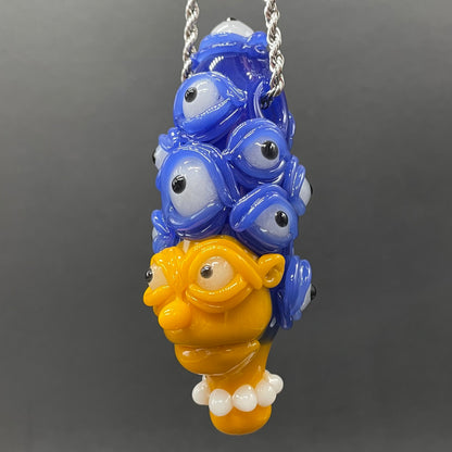 Marge Simpson Mutant handblown glass pendant - yellow Marge Simpson face with towering stack of blue cyclops creatures forming her hair, white pearl beads, silver rope chain - Leviathan Glass