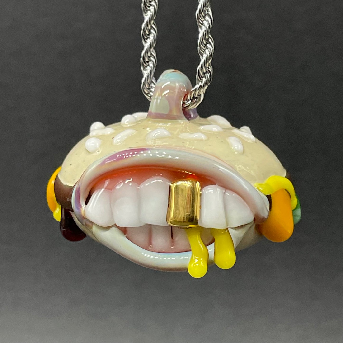Close-up of Glass Cheeseburger pendant - handcrafted glass