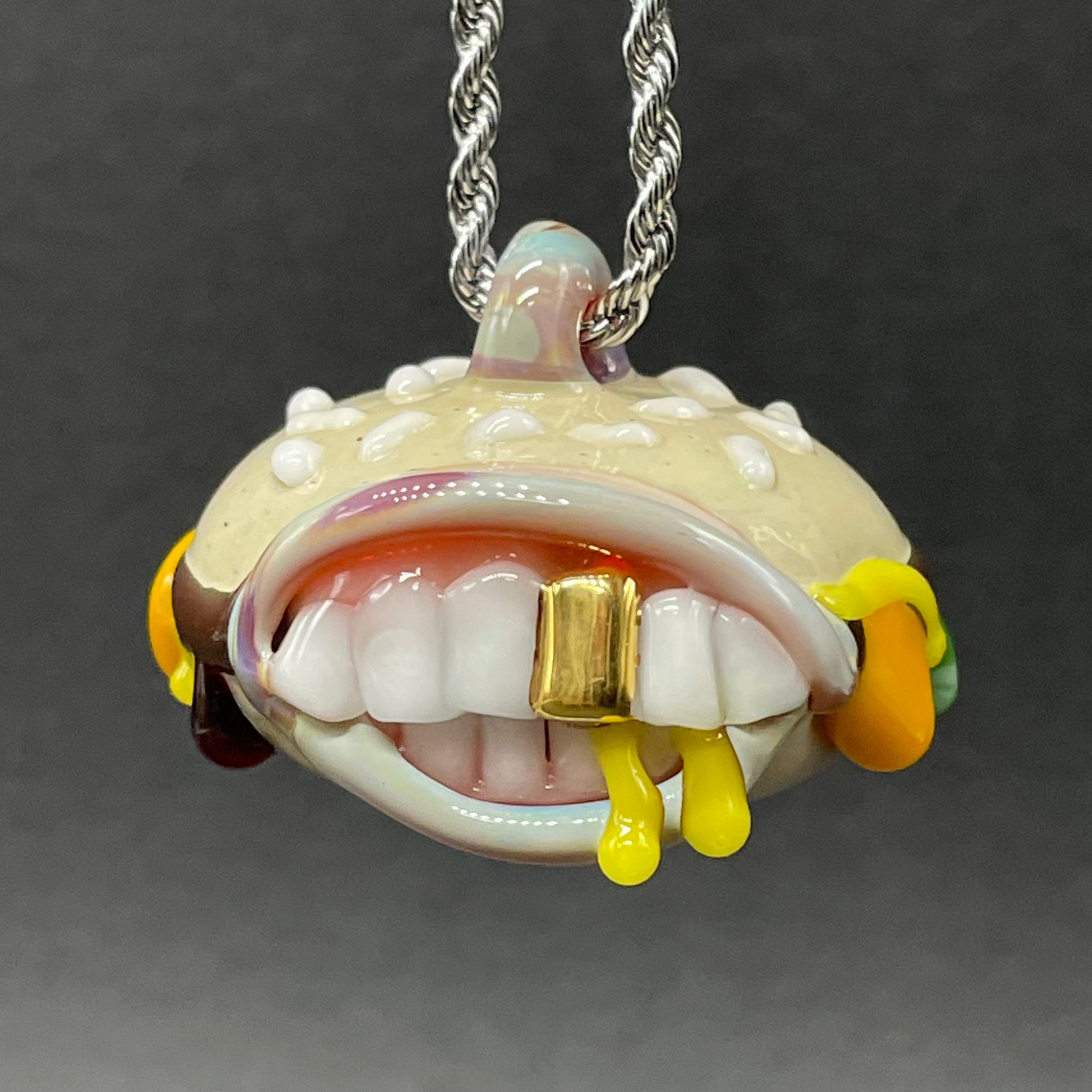 Close-up of Glass Cheeseburger pendant - handcrafted glass