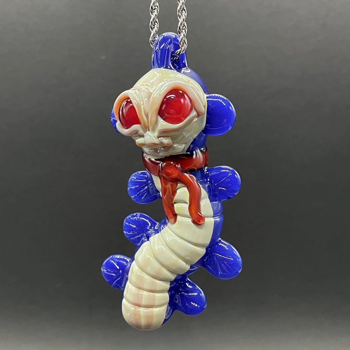 Close-up of Labyrinth worm pendant - handcrafted glass