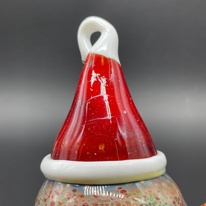 Close-up of Santa hat cyclops ornament - handcrafted glass