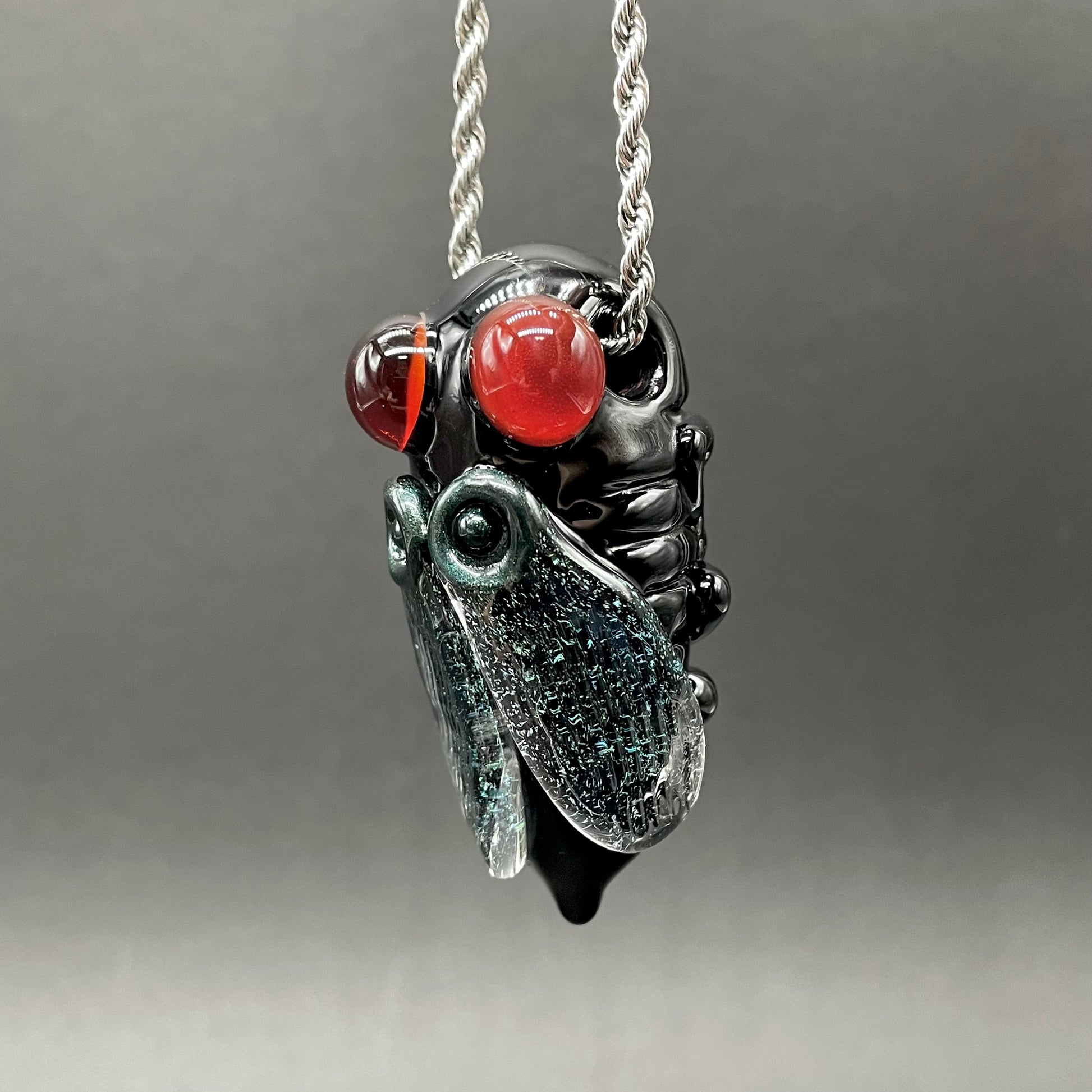 Cicada pendant detail view - premium glass art