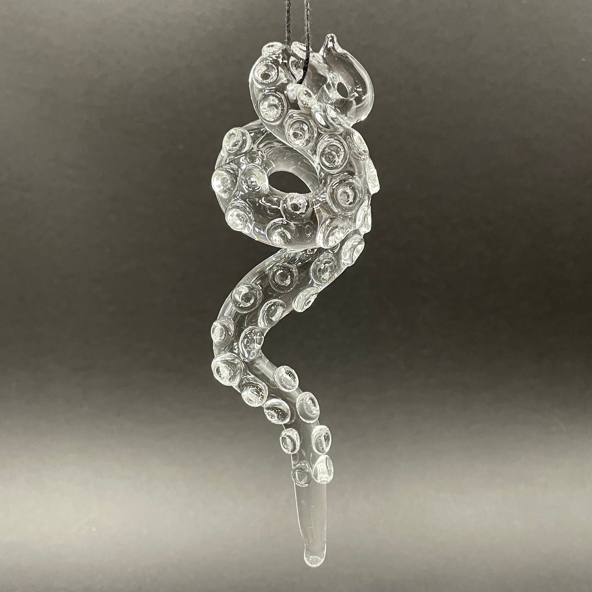 3 clear tentacle ornaments by Leviathan Glass - artisan detail