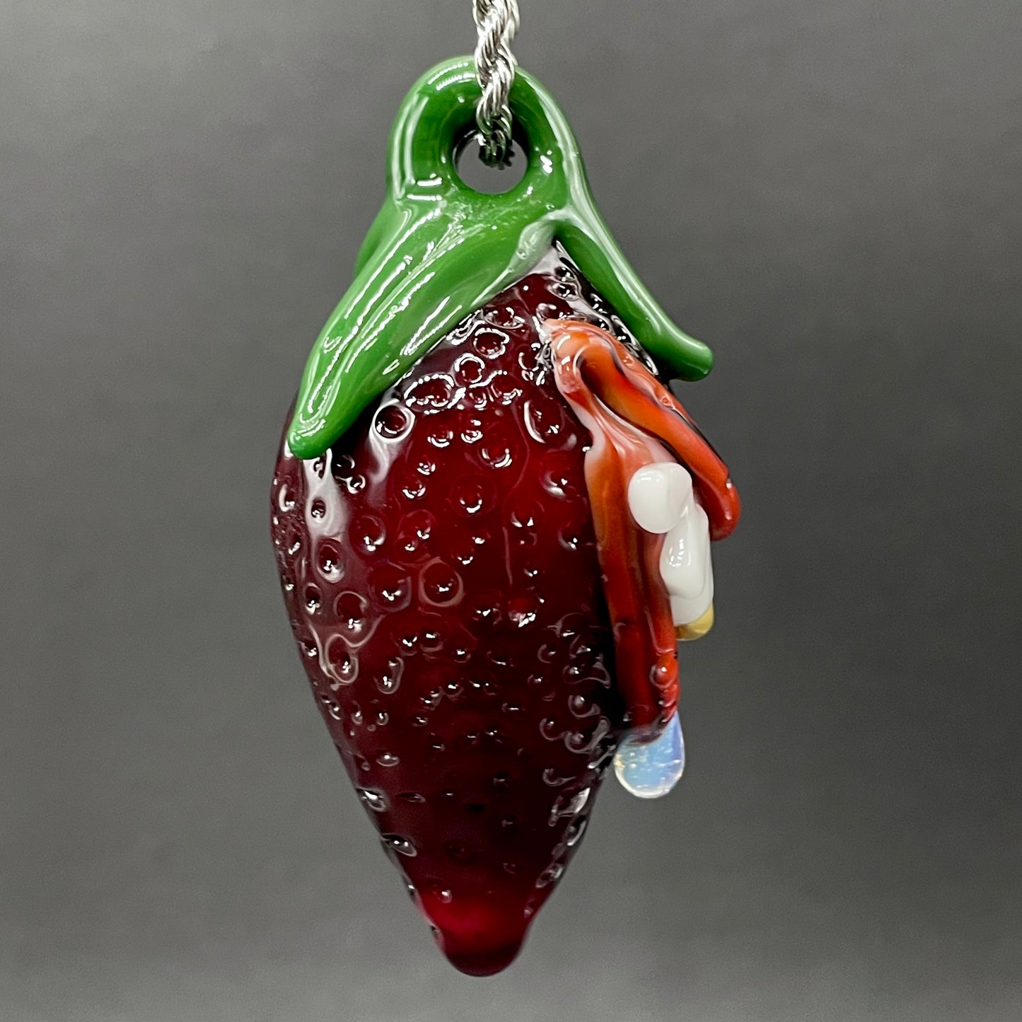 Toothy strawberry pendant by Leviathan Glass - artisan detail