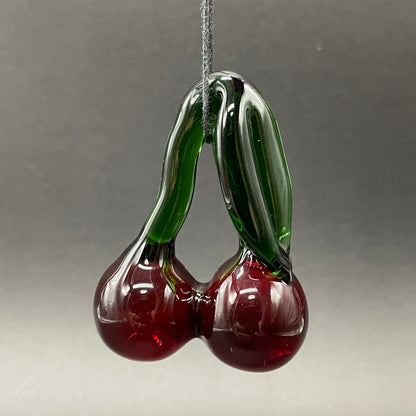 Close-up of Transparent cherry pendant - handcrafted glass