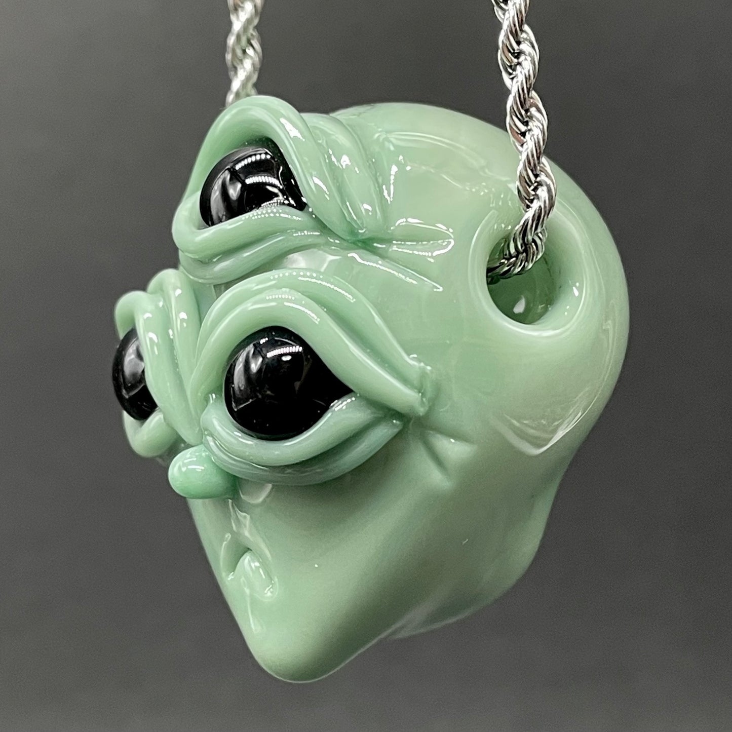 Time manipulating three eye glass alien pendant