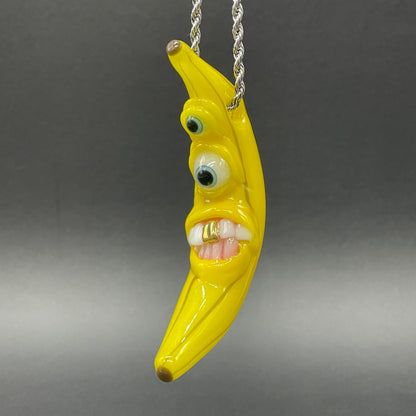Grinning glass banana pendant