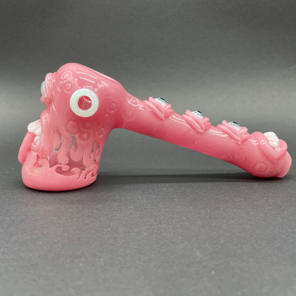 Close-up of Pink evil eye bubbler - handcrafted glass