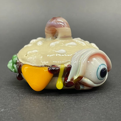 Close-up of Eye love cheeseburger pendant - handcrafted glass