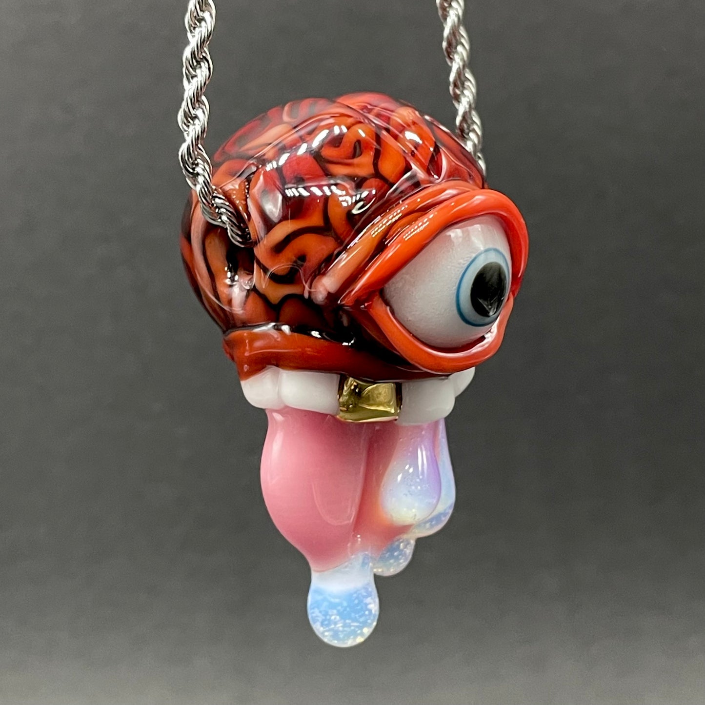 Close-up of Mastermind glass pendant - handcrafted glass
