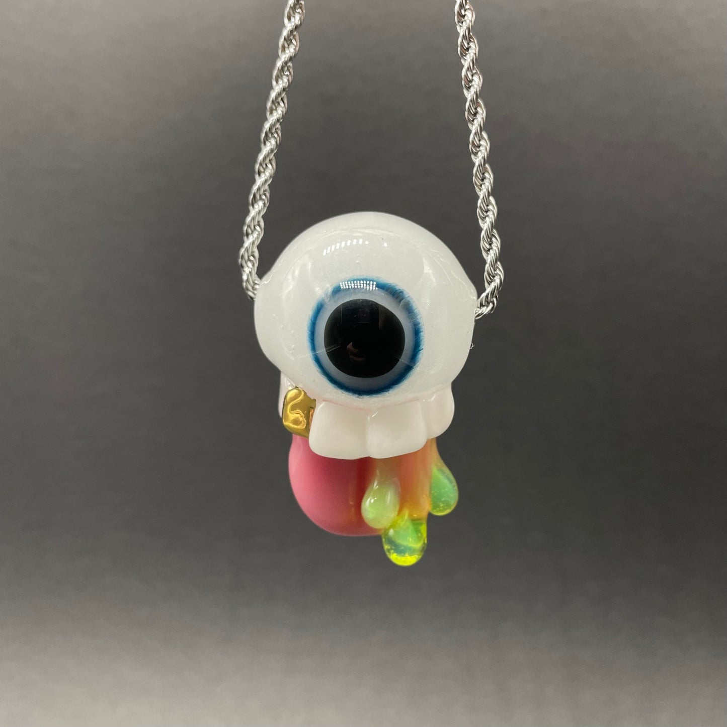 Hand-blown glass Glow in the dark eye pendant by Leviathan Glass