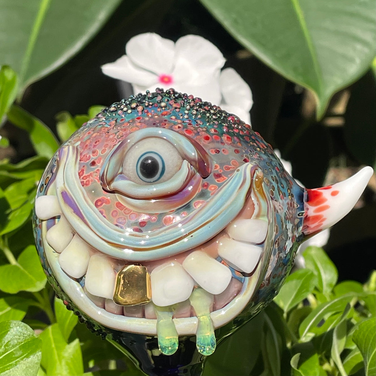 Hand Blown Glass Monster Watering Globe - round cyclops head, blue iris eye, white teeth, gold tooth, teal tongue drips, teal glass stake - Leviathan Glass