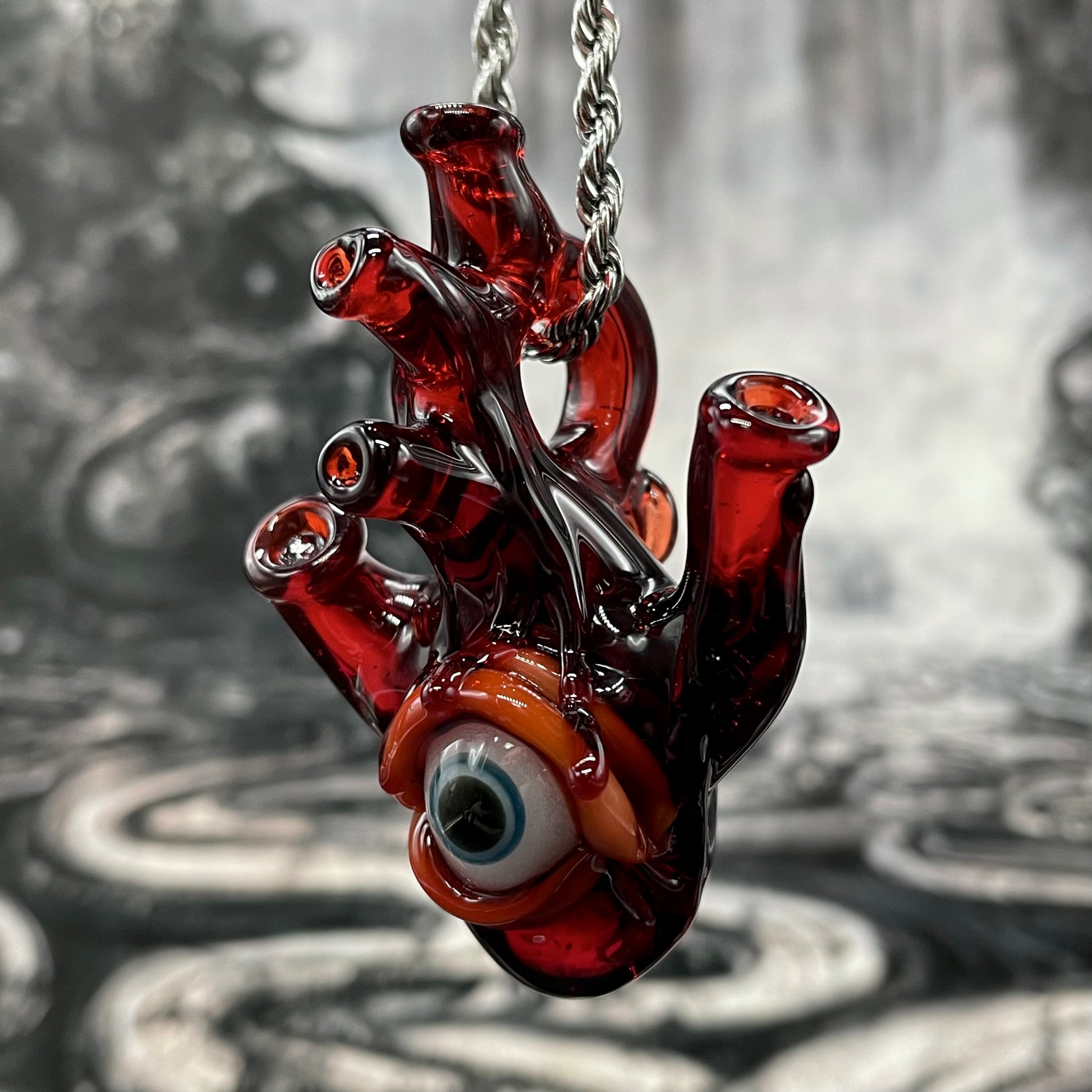 Anatomical cyclops heart pendant detail view - premium glass art