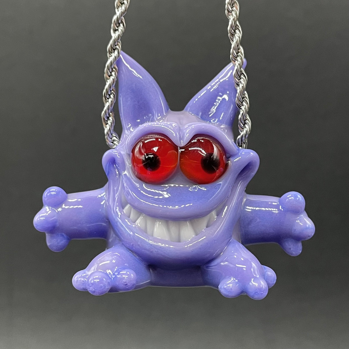 Gengar Pokémon handblown glass pendant - periwinkle purple Gengar sculpture, large red glass eyes, white teeth, clawed hands and feet, silver rope chain - Leviathan Glass
