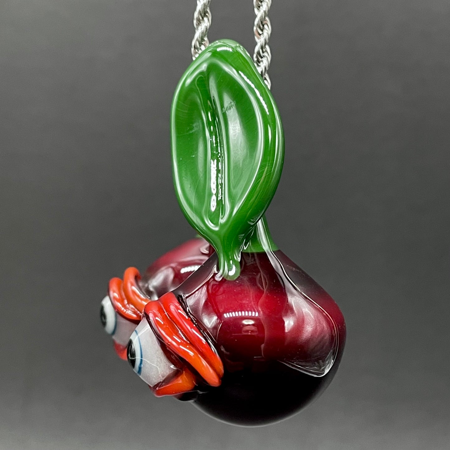Cherry flavored glass eye pendant