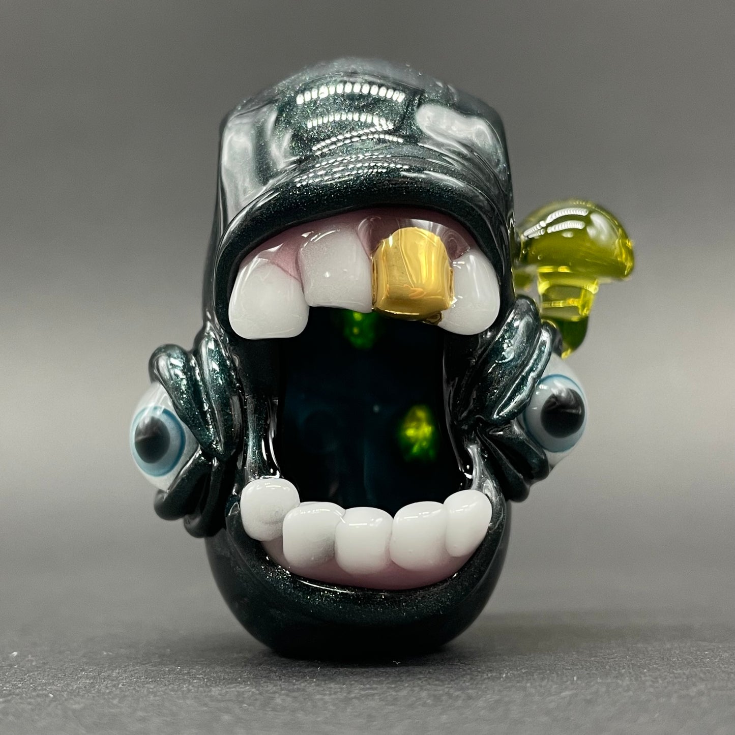 Screaming UV reactive mushroom monster pendant detail view - premium glass art