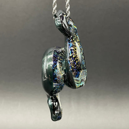 Dichroic rainbow sparkle snake pendant by Leviathan Glass - artisan detail